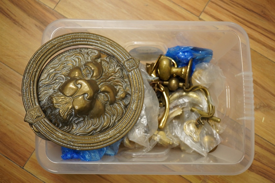 A collection of brass fittings to include lions-head door-knocker and various handles and hinges. Condition - varies